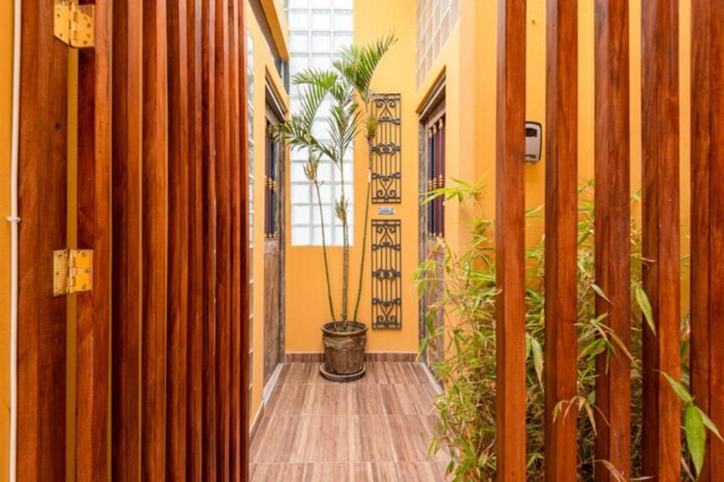 a hallway with a potted plant in a building at Beautiful in Lima