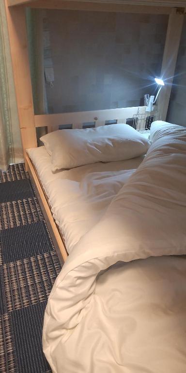 Postel nebo postele na pokoji v ubytování Guest Room安曇野2466