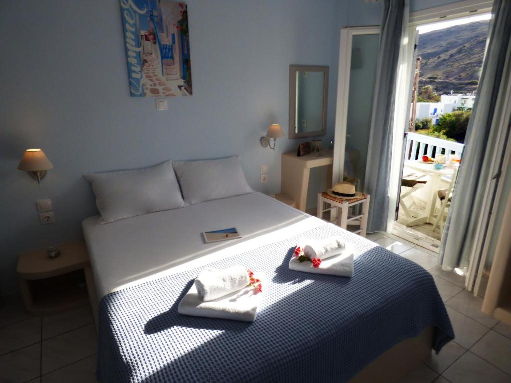 Postel nebo postele na pokoji v ubytování Tasoula Guest House