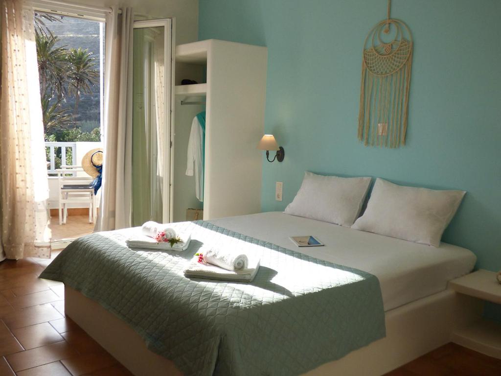 Postel nebo postele na pokoji v ubytování Tasoula Guest House
