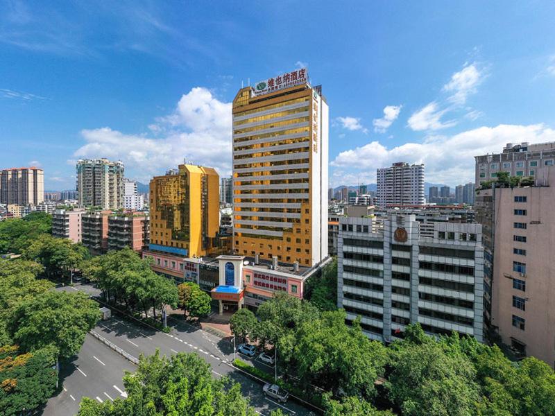 a view of a city with a tall building at Vienna Hotel Qingyuan City Square Lianjiang Road Hotel in Qingyuan