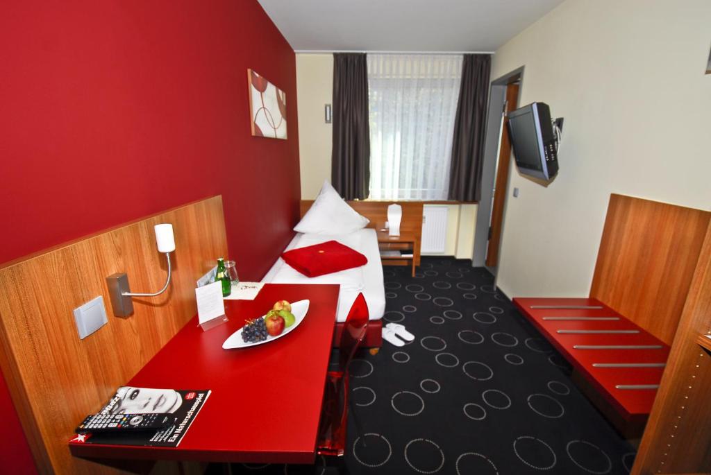 Postel nebo postele na pokoji v ubytování Hotel Central