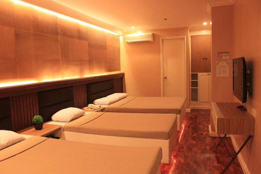 TV a/nebo společenská místnost v ubytování Urban Travellers Hotel