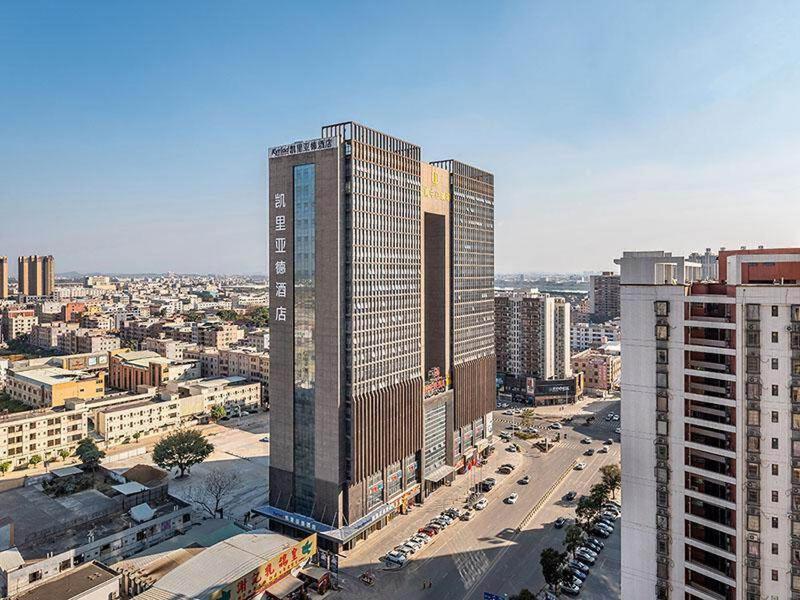 an aerial view of a city with tall buildings at Kyriad Marvelous Hotel Huizhou Boluo Yuanzhou in Boluo