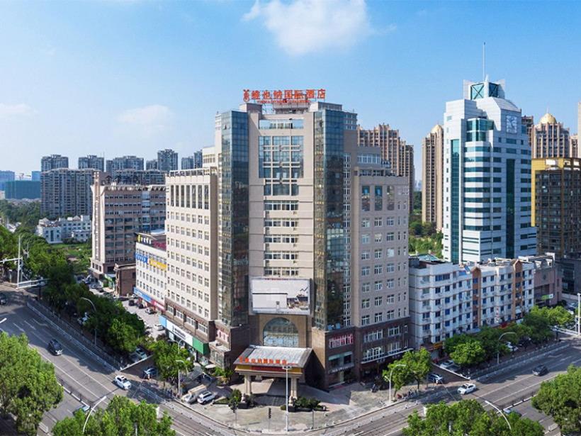 an aerial view of a city with tall buildings at Vienna International Hotel Taizhou Wenling Branch in Taizhou