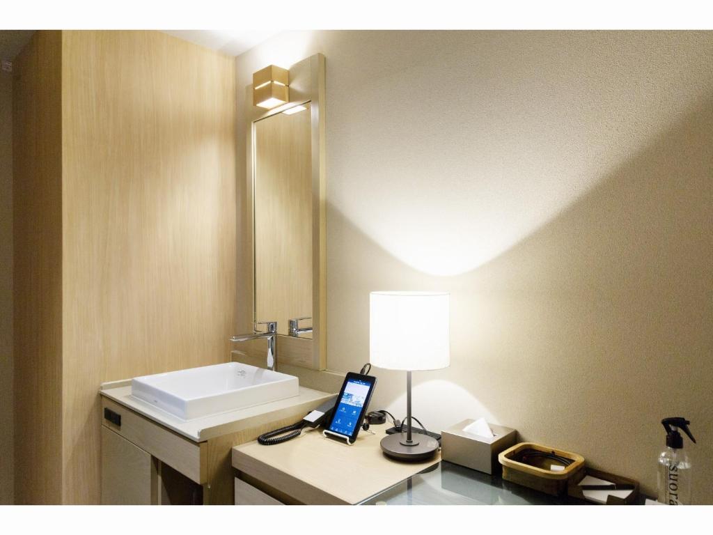 Koupelna v ubytování HOTEL HILLARYS Shinsaibashi
