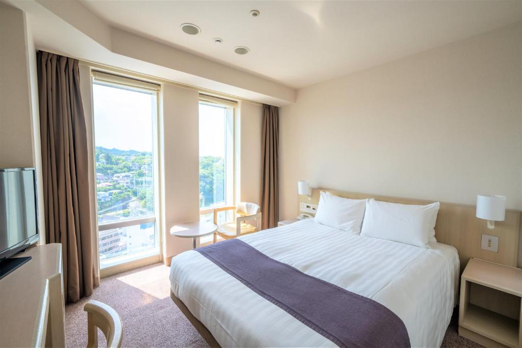 Postel nebo postele na pokoji v ubytování Mercure Yokosuka