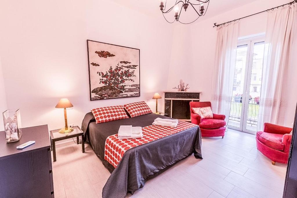 a bedroom with a bed and a living room at Liguria Terrace in Olbia