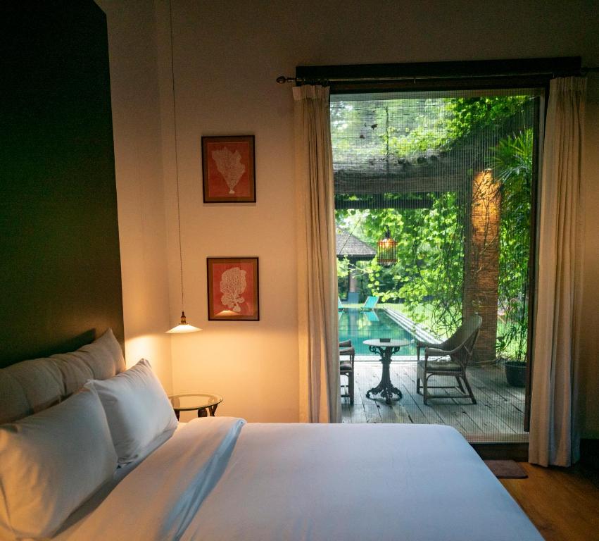 Postel nebo postele na pokoji v ubytování Chandra Residence