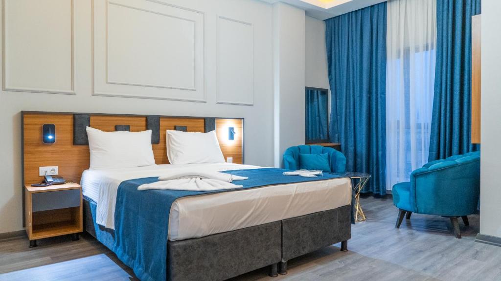 Postel nebo postele na pokoji v ubytování GRAND MOON HOTEL