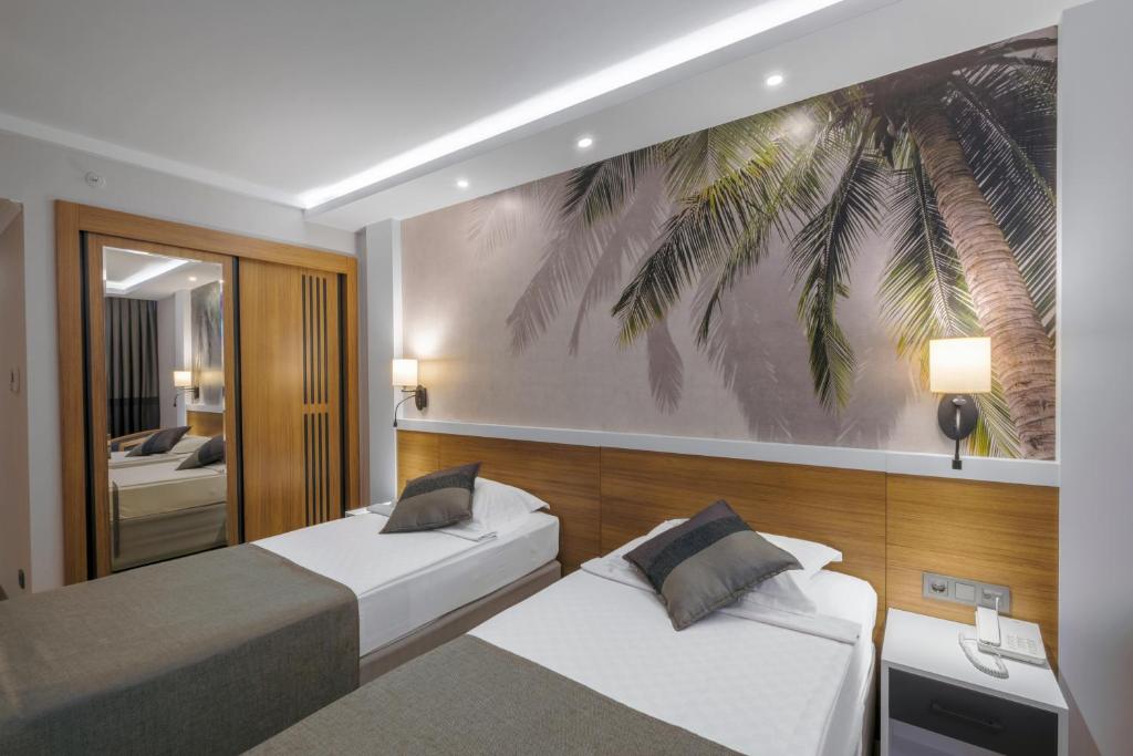 Postel nebo postele na pokoji v ubytování Alba Resort Hotel - Ultra All Inclusive