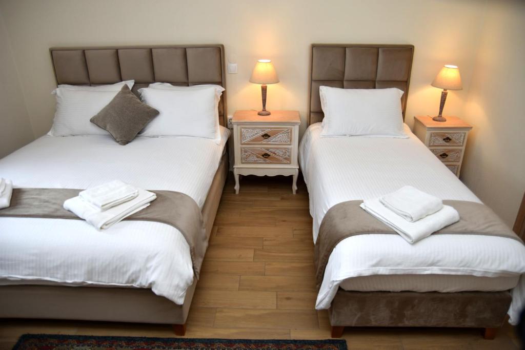 Postel nebo postele na pokoji v ubytování NUCA GUESTHOUSE