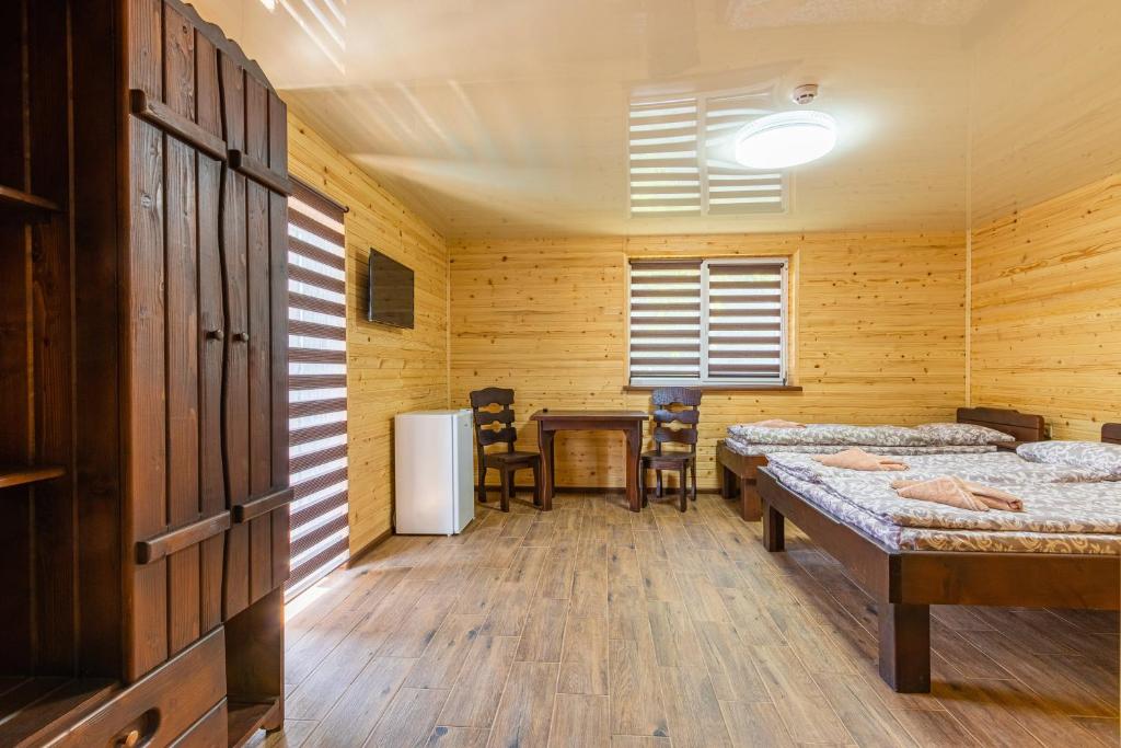 Postel nebo postele na pokoji v ubytování Комплекс СільДар