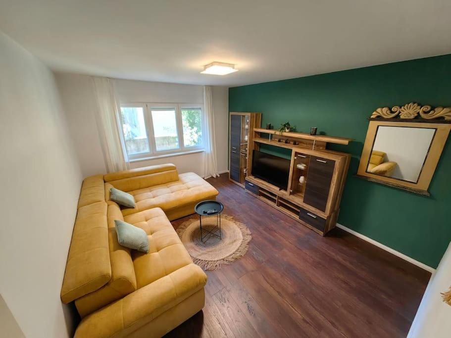 a living room with a couch and a television at New 1 bedroom near Center and beach in Split