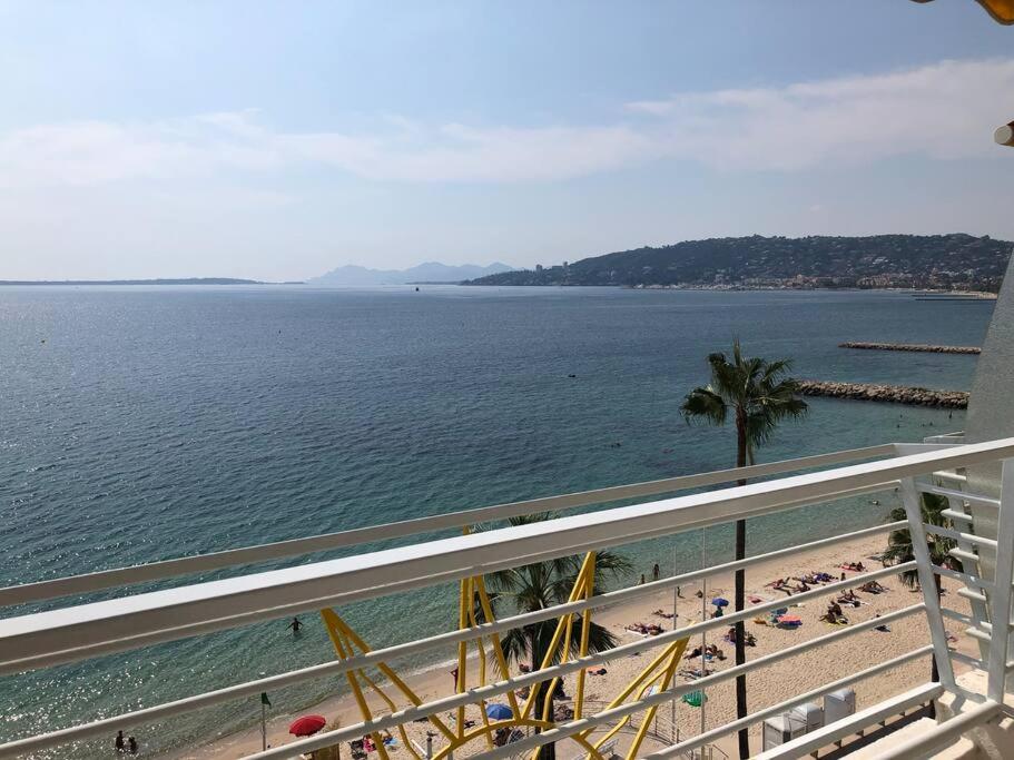a view of the beach from the balcony of a resort at Soleil 2023 in Antibes