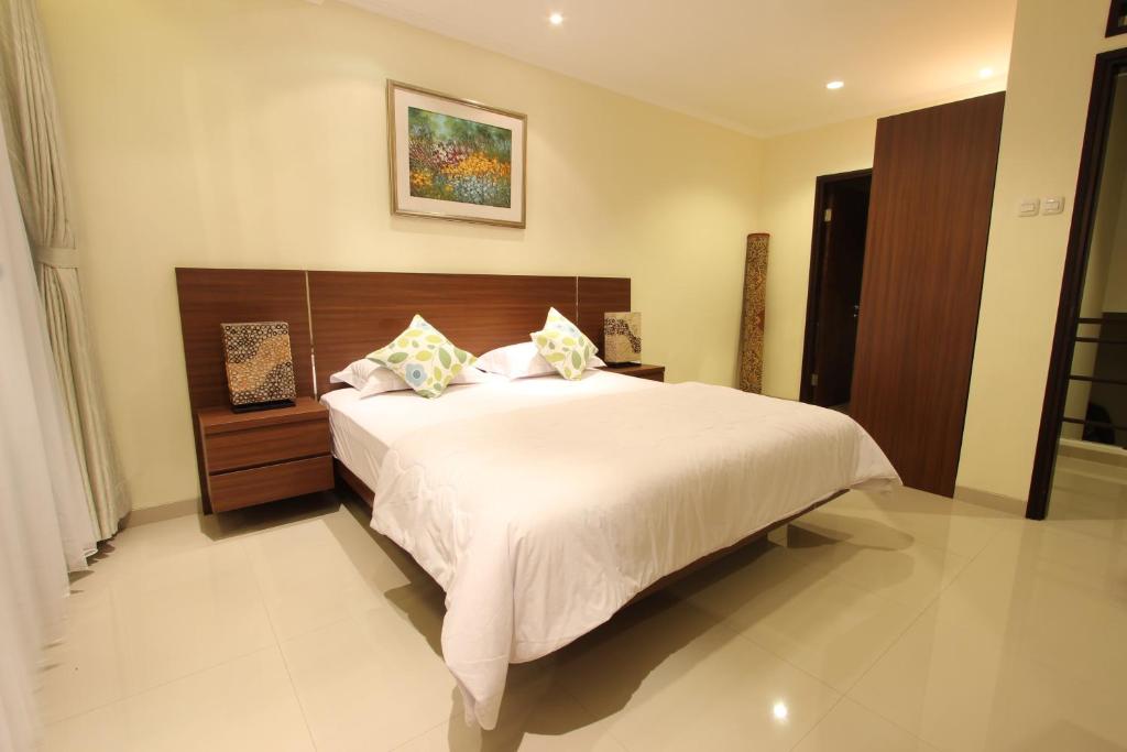Кровать или кровати в номере De Reiz Villa Kesuma Syariah