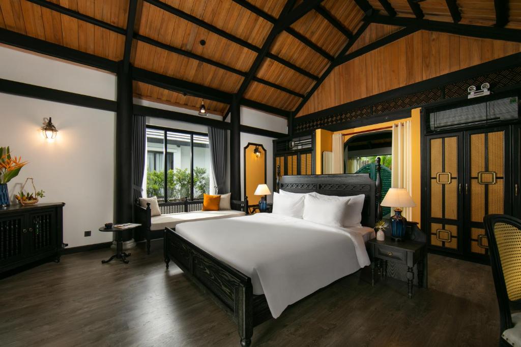 Postel nebo postele na pokoji v ubytování Bliss Hoi An Beach Resort & Wellness
