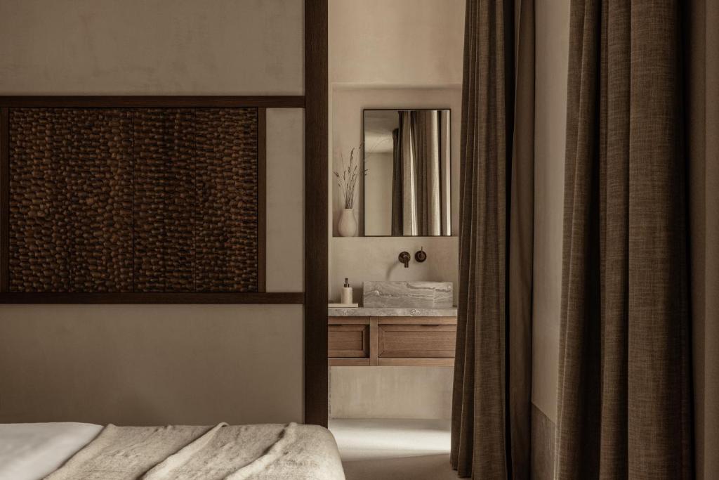 Postel nebo postele na pokoji v ubytování MANNA, a Member of Design Hotels