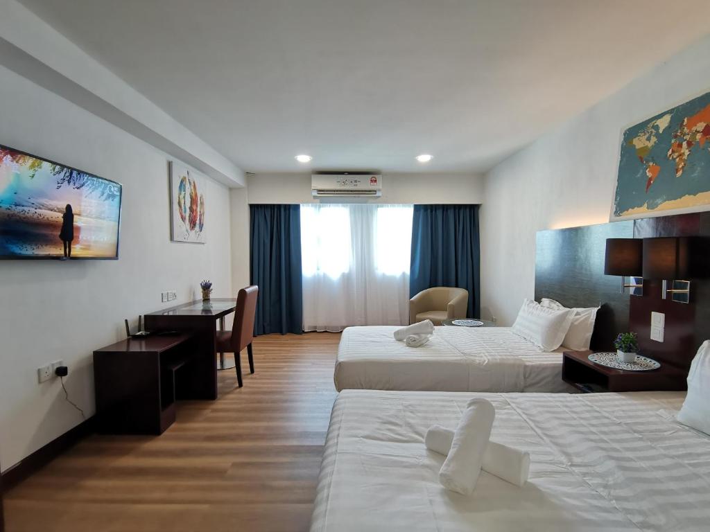 Letto o letti in una camera di Ming Greenage Suite 明绿时代套房 @Kota Kinabalu 亚庇市中心