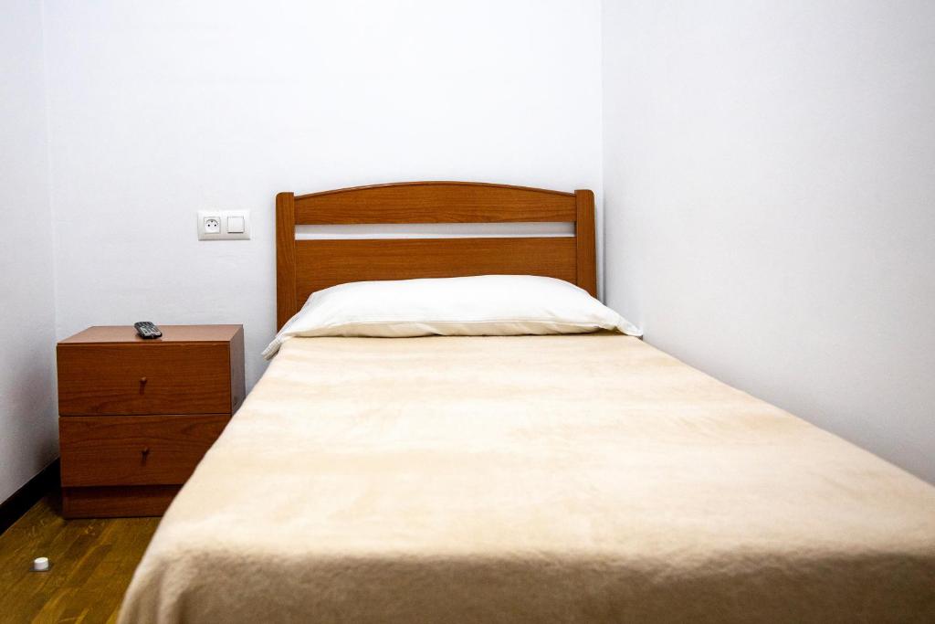 Postel nebo postele na pokoji v ubytování Yani's Hospedaje Pension 1 estrella