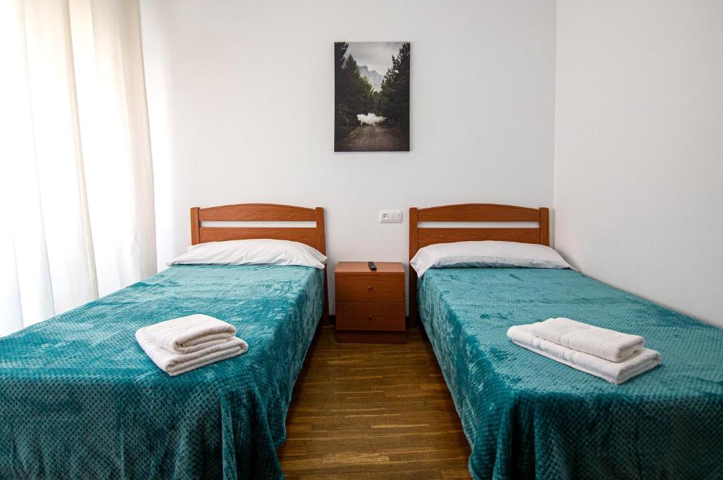 Postel nebo postele na pokoji v ubytování Yani's Hospedaje Pension 1 estrella