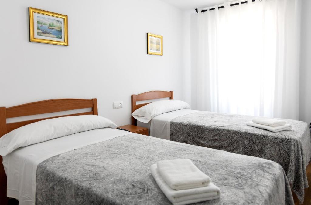 Postel nebo postele na pokoji v ubytování Yani's Hospedaje Pension 1 estrella