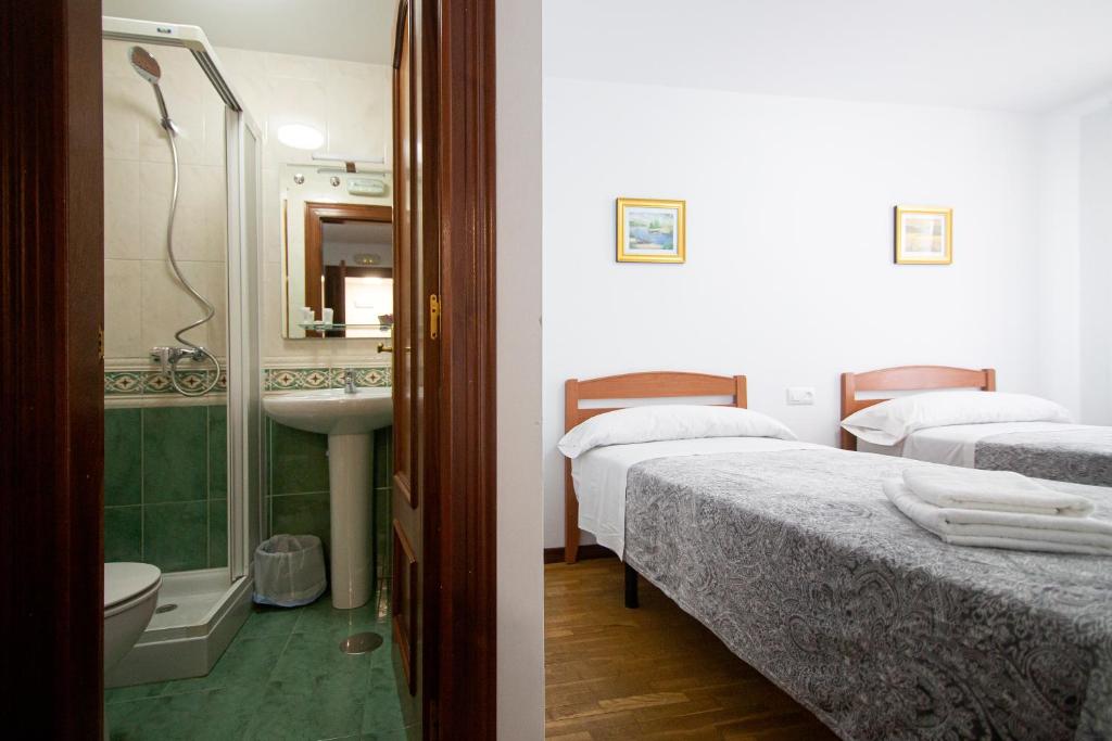 Postel nebo postele na pokoji v ubytování Yani's Hospedaje Pension 1 estrella
