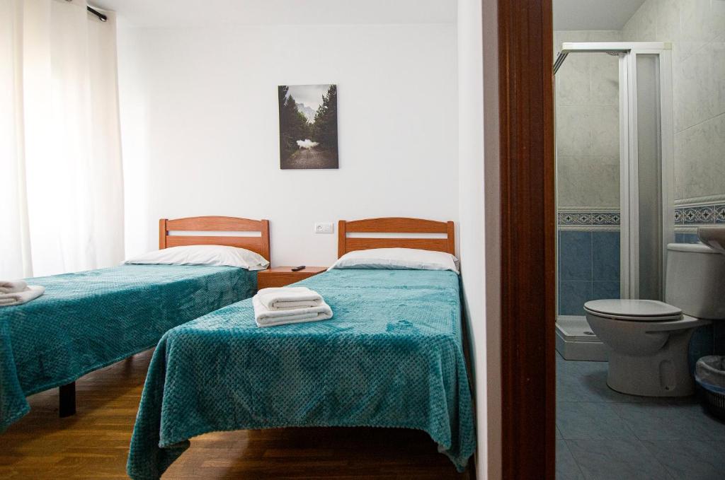 Postel nebo postele na pokoji v ubytování Yani's Hospedaje Pension 1 estrella