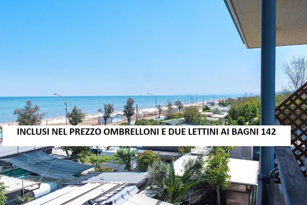 a view of the beach from the balcony of a house at SE008 - Senigallia, bilocale sul mare con spiaggia in Senigallia