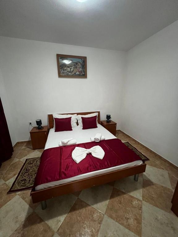 Postel nebo postele na pokoji v ubytování Kasneci Apartments