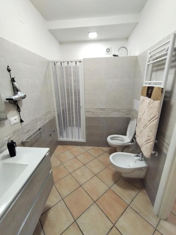 a bathroom with a toilet and a sink at B&B VILLA RITA in Silvi Marina