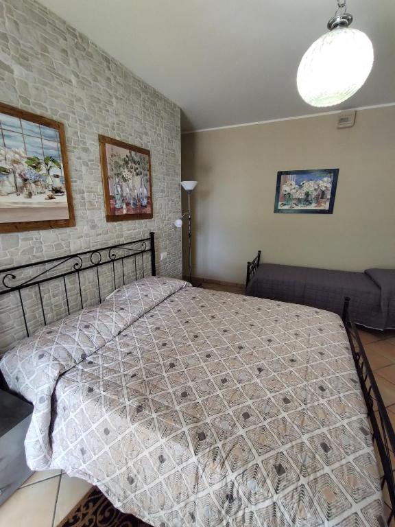 a bedroom with a large bed in a room at B&B VILLA RITA in Silvi Marina