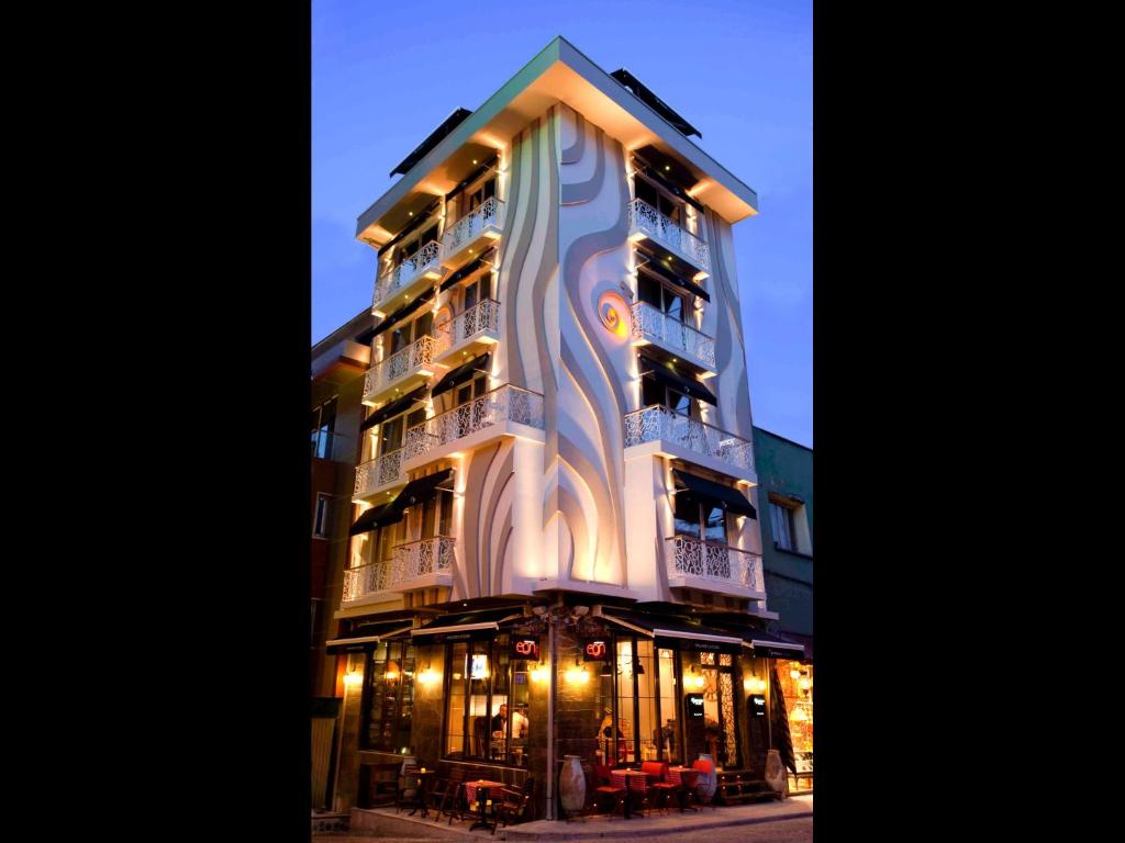 a tall building with lights on the side of it at Hypnos Design Hotel in Istanbul