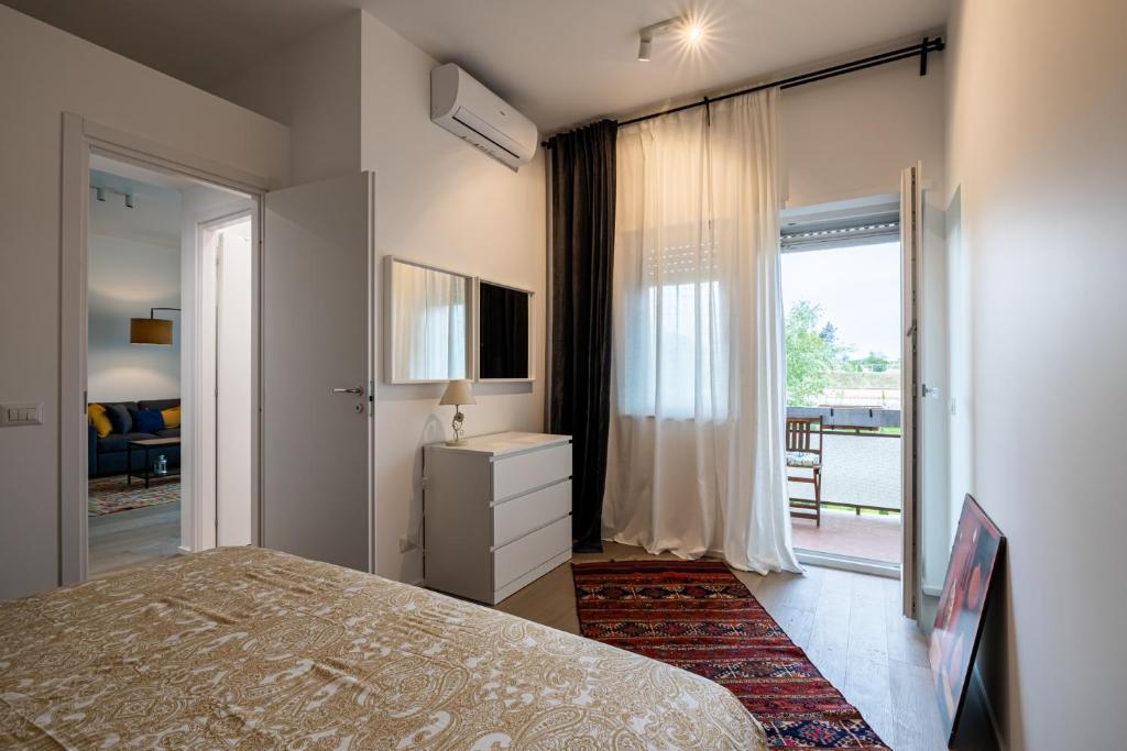 a bedroom with a bed and a window with a view at Aurelia Antica Plaza Suite in Rome