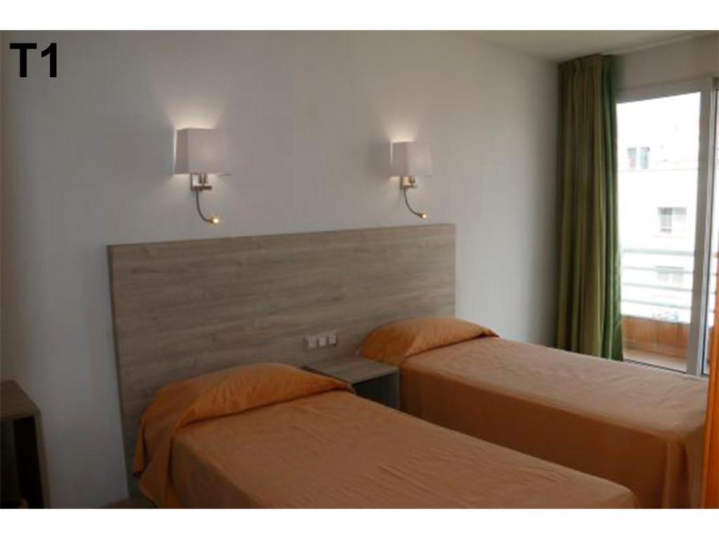 Posteľ alebo postele v izbe v ubytovaní Apartaments Sala Mar