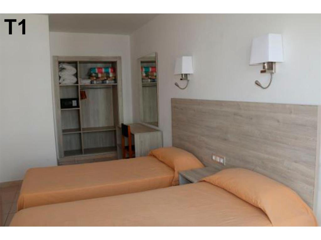 Posteľ alebo postele v izbe v ubytovaní Apartaments Sala Mar