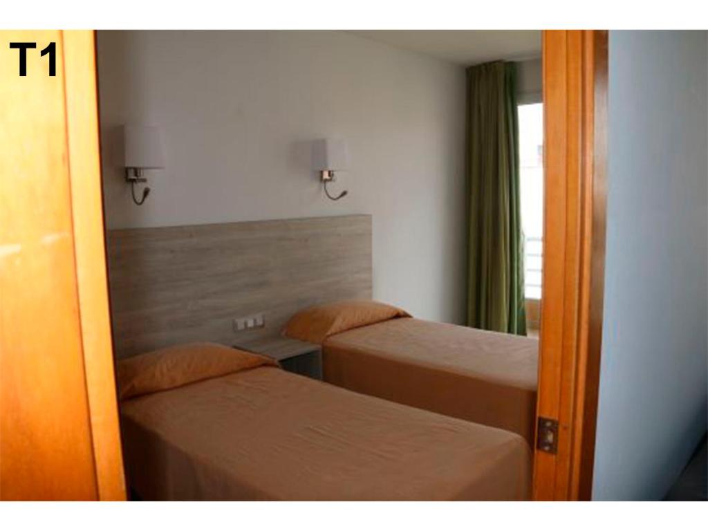 Posteľ alebo postele v izbe v ubytovaní Apartaments Sala Mar