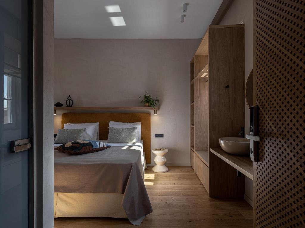 Postel nebo postele na pokoji v ubytování Casa Modiano Boutique