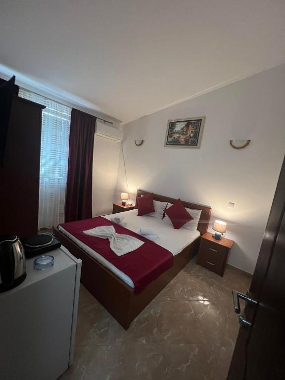 Postel nebo postele na pokoji v ubytování Kasneci Apartments