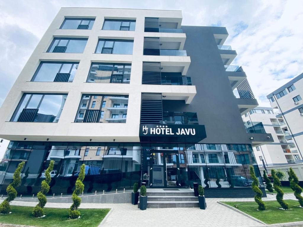 a building with a hotel law sign in front of it at Hotel Javu in Mamaia Sat/Năvodari