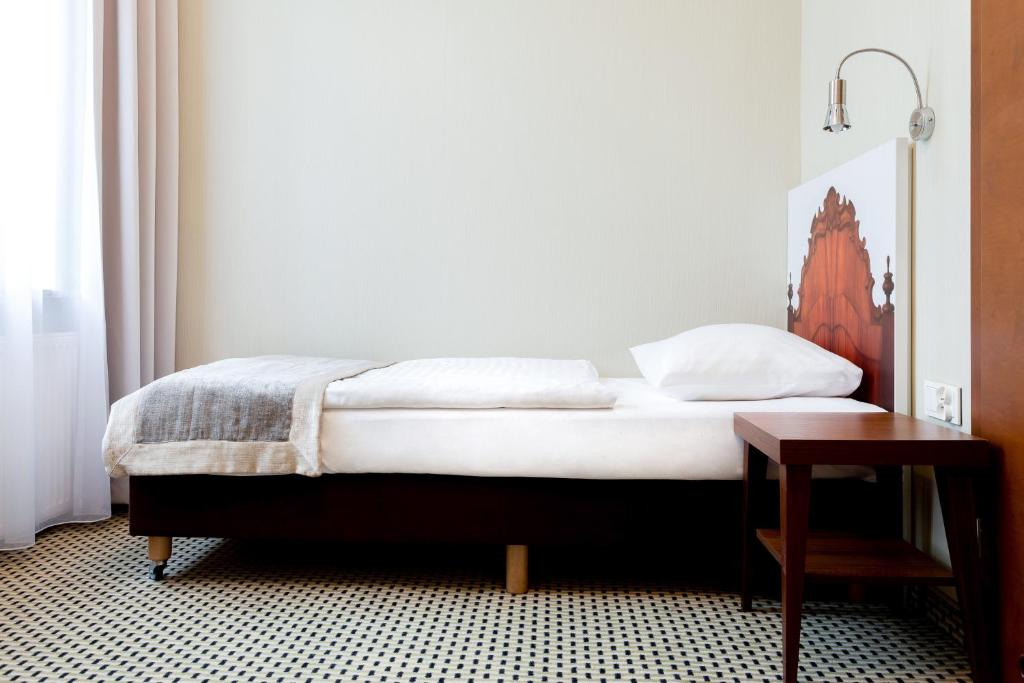 Posteľ alebo postele v izbe v ubytovaní Jantar Hotel & SPA by Zdrojowa