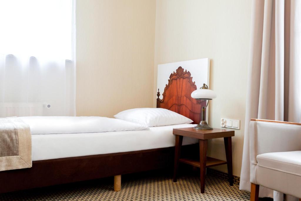 Posteľ alebo postele v izbe v ubytovaní Jantar Hotel & SPA by Zdrojowa