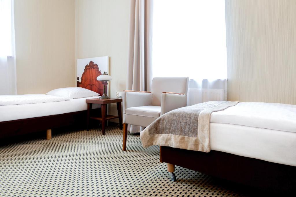 Posteľ alebo postele v izbe v ubytovaní Jantar Hotel & SPA by Zdrojowa