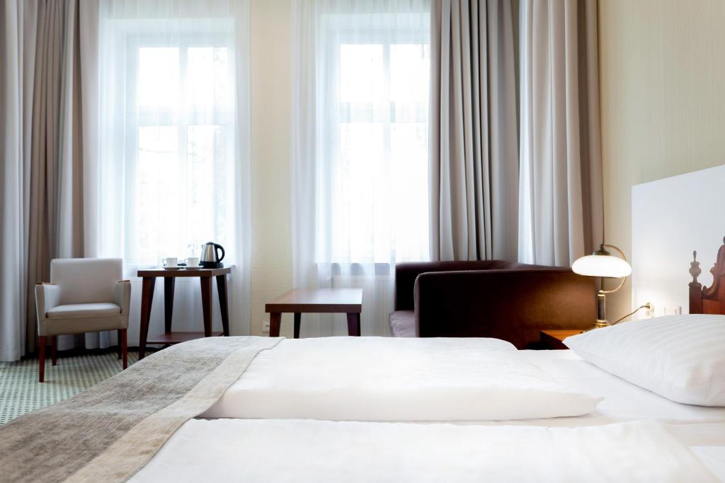 Posteľ alebo postele v izbe v ubytovaní Jantar Hotel & SPA by Zdrojowa