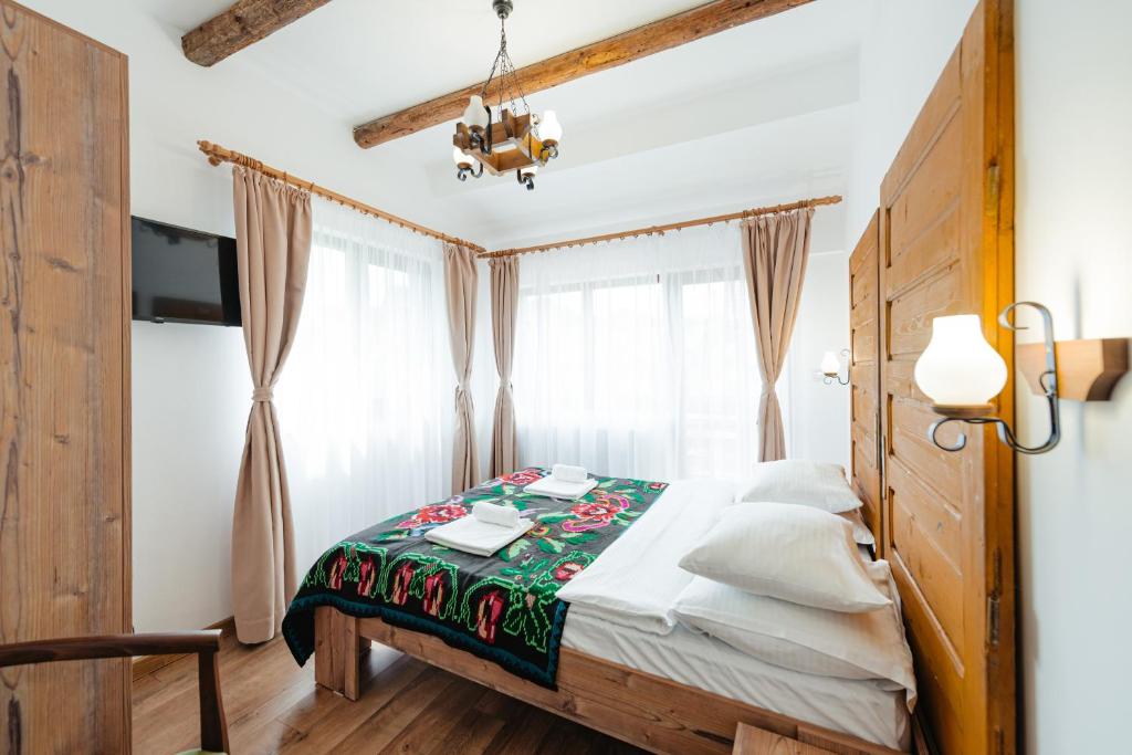 Postel nebo postele na pokoji v ubytování CONACUL TRANSILVAN