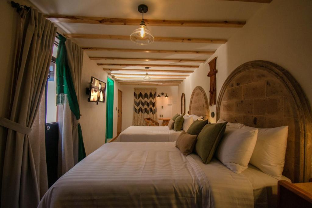 Postel nebo postele na pokoji v ubytování Casa Moseua