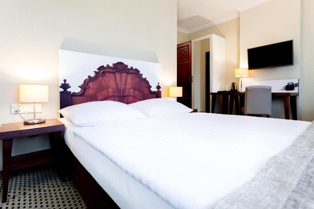 Posteľ alebo postele v izbe v ubytovaní Jantar Hotel & SPA by Zdrojowa