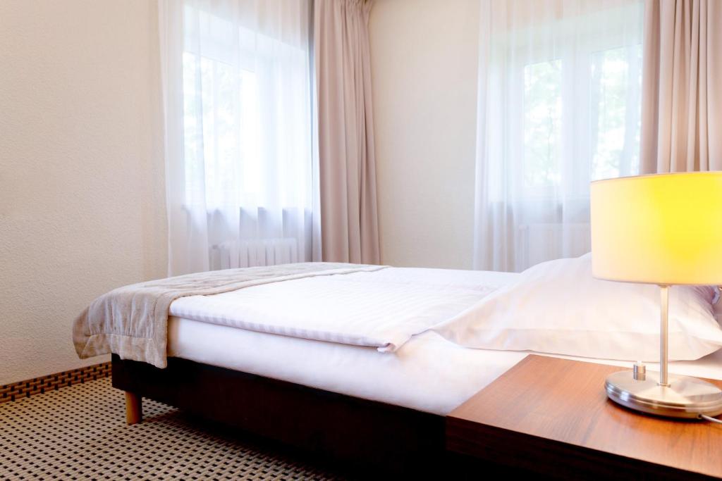 Posteľ alebo postele v izbe v ubytovaní Jantar Hotel & SPA by Zdrojowa