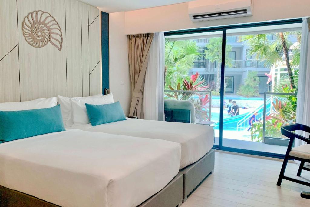 Postel nebo postele na pokoji v ubytování Best Western Plus Carapace Hotel Hua Hin