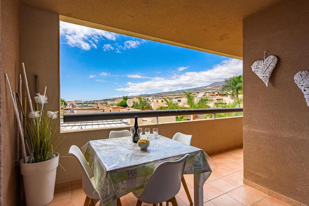 a dining room with a table and a large window at Paraiso II EQ FREE WIFI in Playa Paraiso
